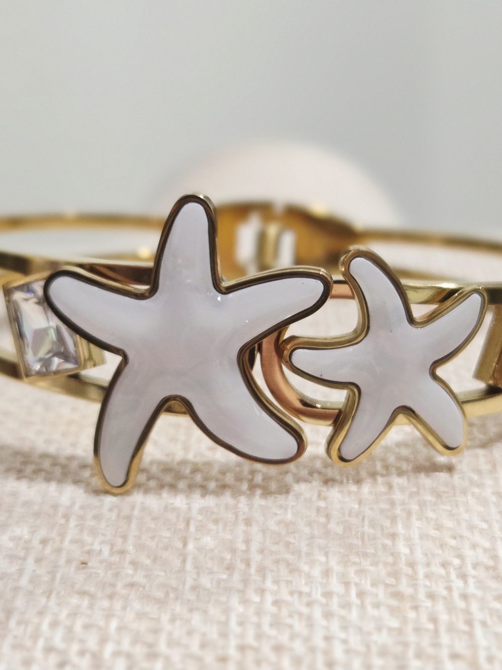 Gold Bangle Bracelet with White Starfish Accents